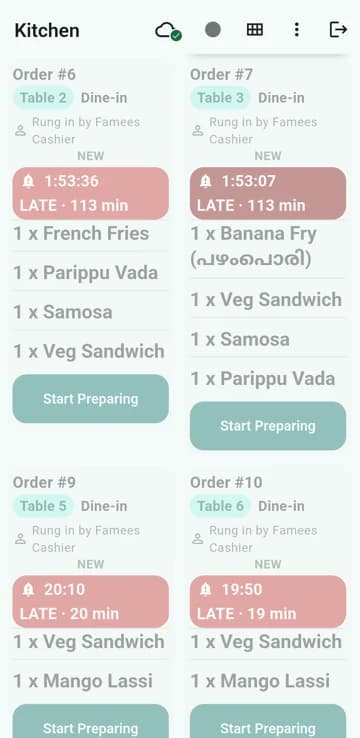 Two kitchen tickets in focus with large dish names